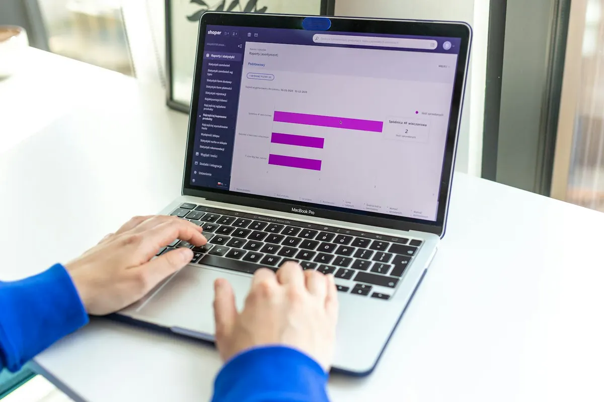 A desk setup with reports, a keyboard, and marketing notes for planning editorial campaigns.