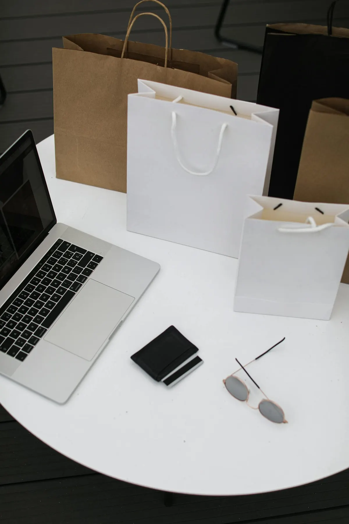 A team reviewing ecommerce growth metrics together on laptops in a bright workspace.