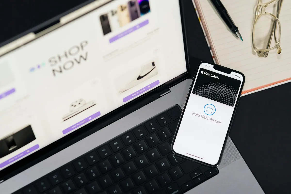 A founder reviewing platform migration notes beside an online store dashboard.